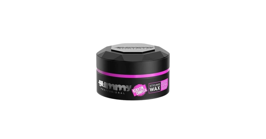 Gummy hair styling wax container with thick wax texture and an edge brush