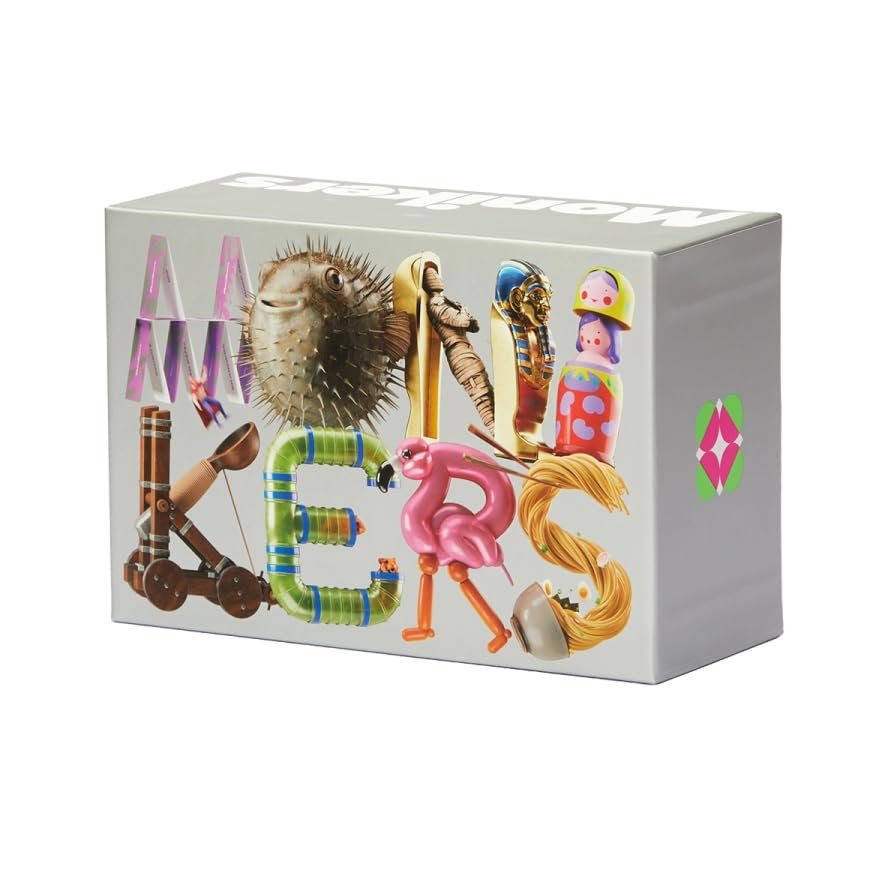 Monikers party game cards spread on a table with a score pad