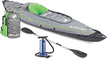 Sevylor QuickPak K1 inflatable kayak packed down in carry system and set up beside calm water