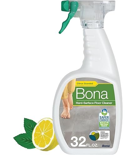 Bona hard-surface floor cleaner spray bottle on vinyl plank floor with microfiber pad