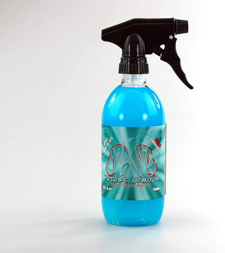 Dodo Juice Tropical Mist spray wax on black sports car surface