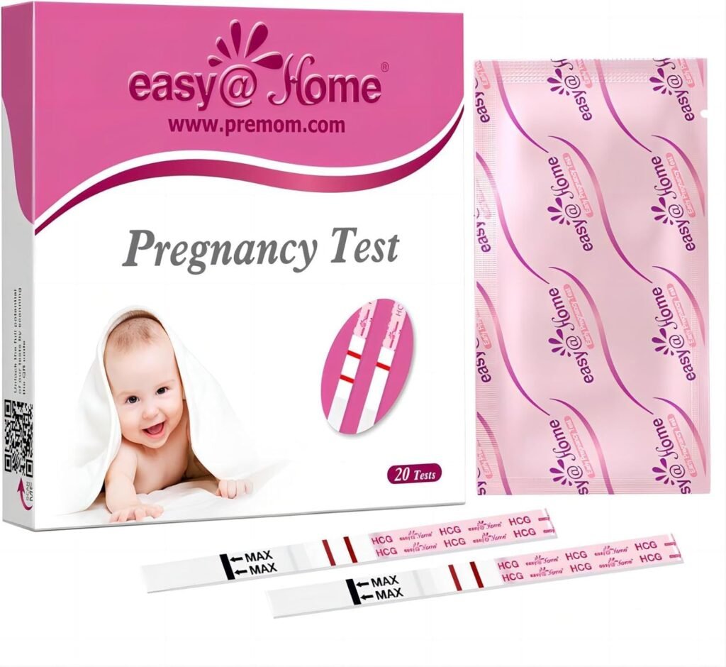 Easy@Home pregnancy test strips laid out beside a urine cup for home early testing