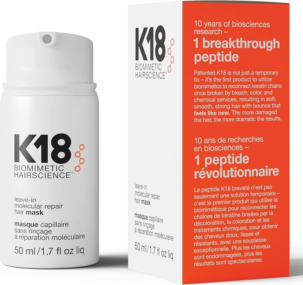 K18 molecular repair leave-in hair mask bottle on salon counter