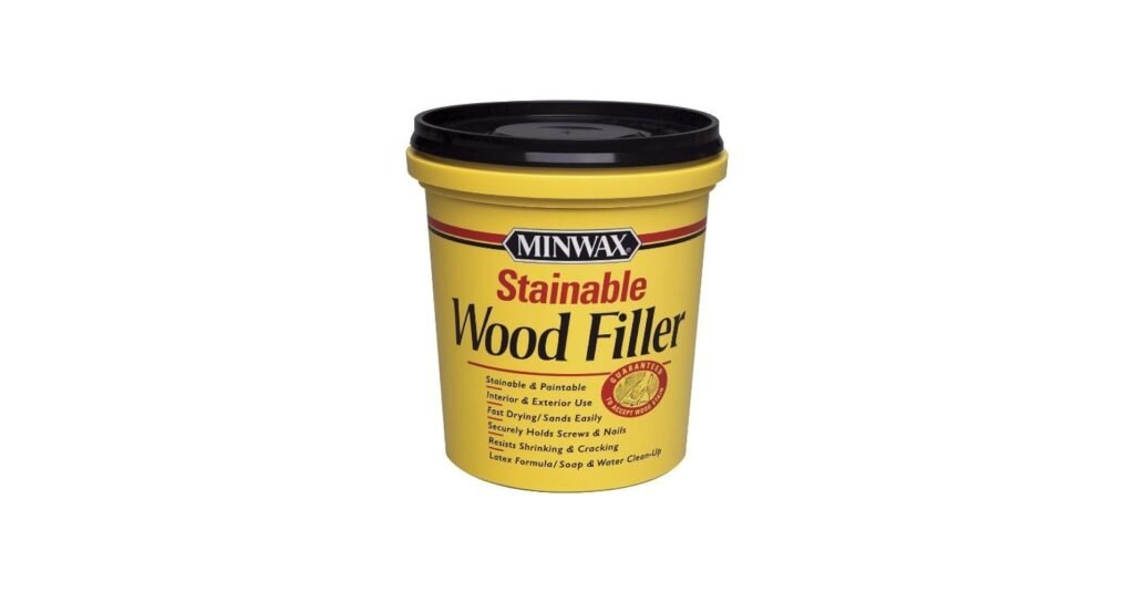 Minwax stainable wood filler applied to oak board before staining in workshop