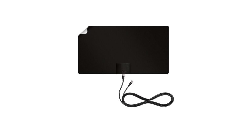 Mohu Leaf Supreme Pro amplified indoor TV antenna mounted on wall near window in living room