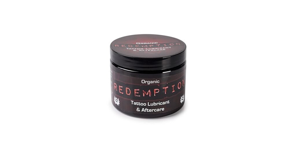 Redemption Tattoo Care organic aftercare balm in a small jar for tattoo healing
