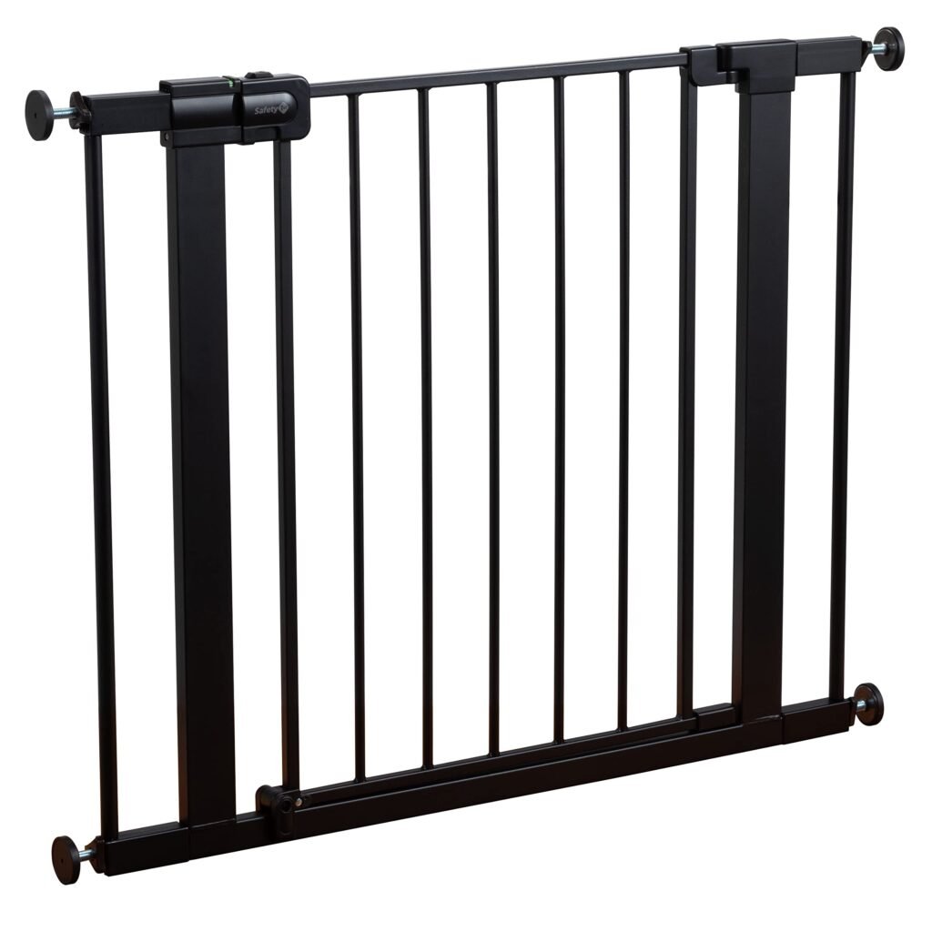 Safety 1st walk-through baby gate in a hallway with white frame and easy-release handle