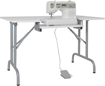 Sew Ready folding sewing table with metal frame and lower storage shelf in small apartment