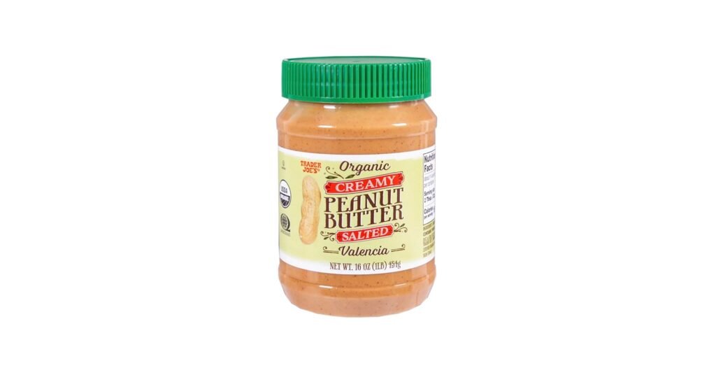 Glass jar of Trader Joe’s natural peanut butter with visible oil separation on top