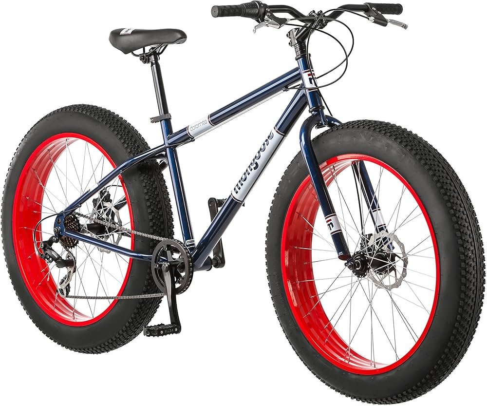 Mongoose Dolomite fat tire mountain bike with wide knobby tires on a dirt trail