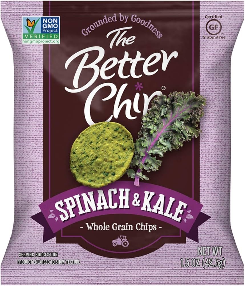 Fresh spinach and kale leaves arranged on kitchen counter