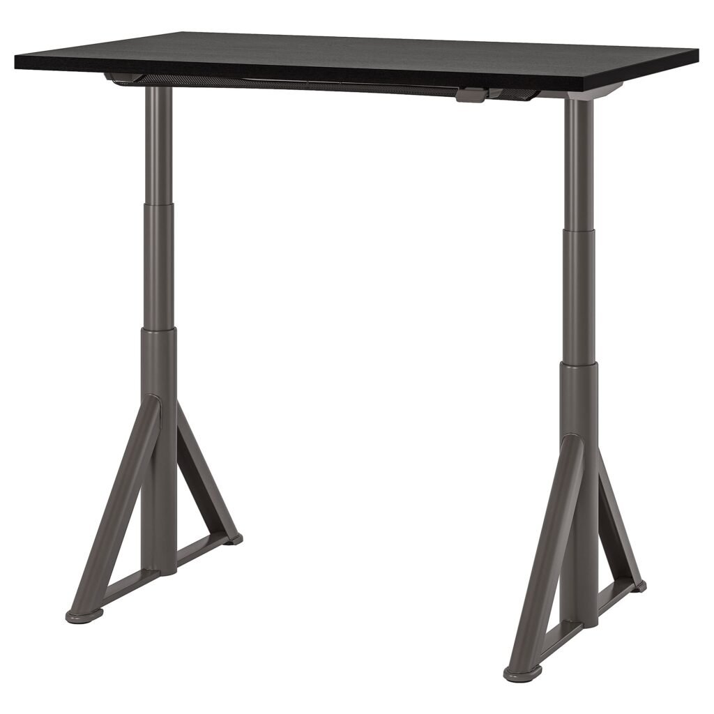 IKEA IDÅSEN desk with a dark top, metal legs, and hidden cable net under the tabletop