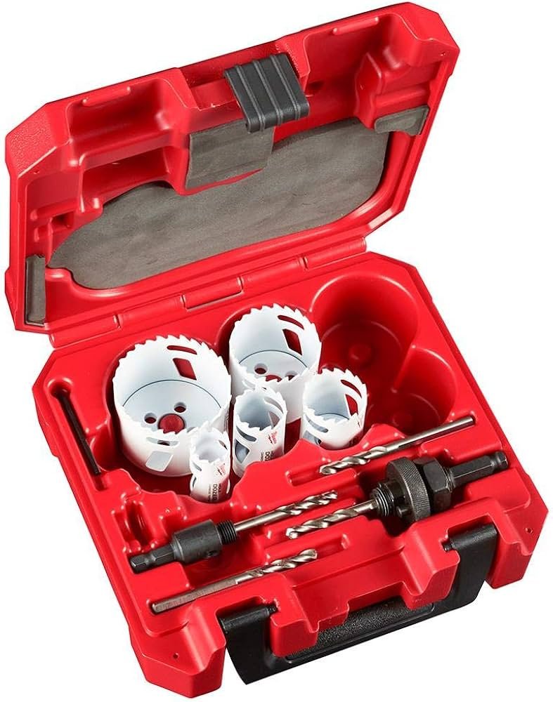 Milwaukee carbide hole saw cutting circular opening in metal panel