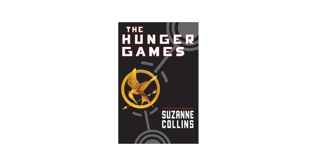 Teen holding The Hunger Games paperback set with bold titles and a mockingjay cover design