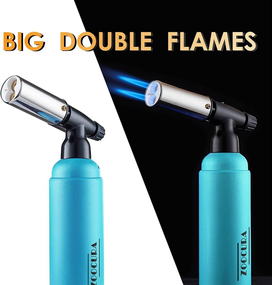 Zoocura dual flame dab torch producing a soft adjustable flame on a quartz banger