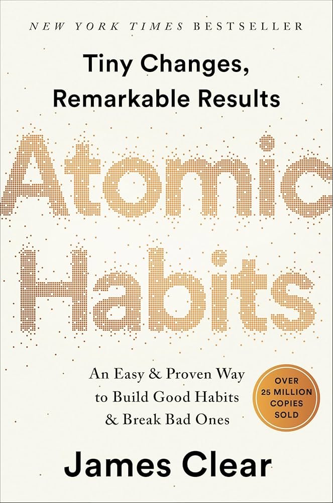 “Atomic Habits” book cover with habit tracker page, representing the best self-help books for men for routines and consistency.