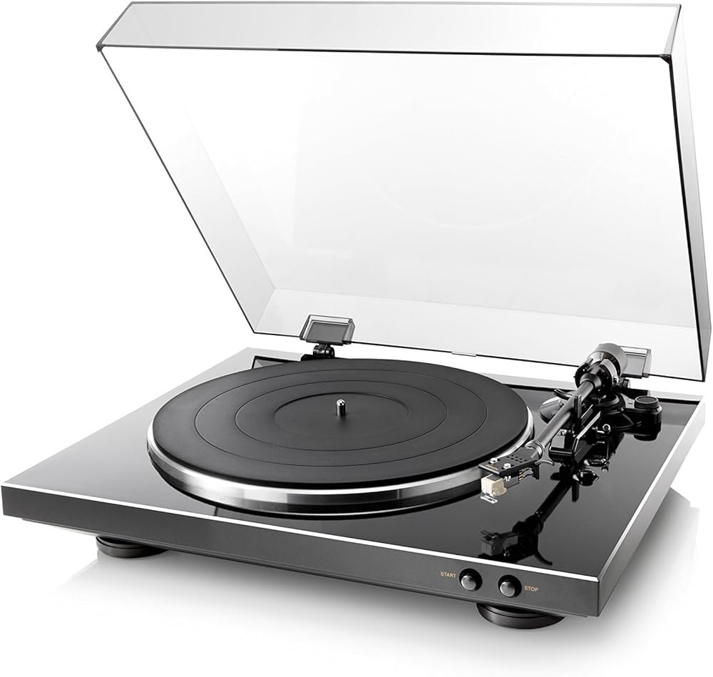Denon DP-300F automatic record player with a dust cover and a record playing, highlighted for beginner ease.