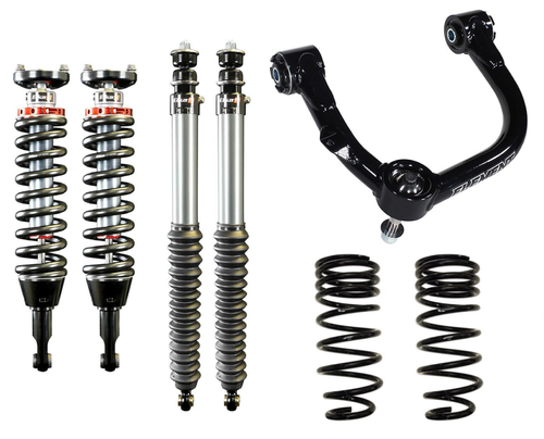 Elka dual adjustable shocks fitted on a Toyota Tacoma suspension setup, shown as a tuning-focused lift option for 2026.