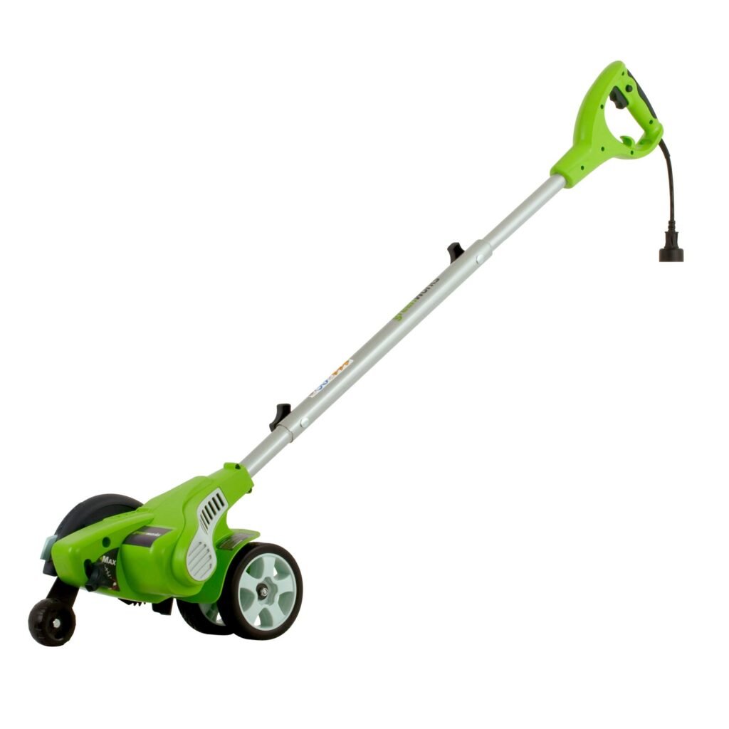 Greenworks 12-amp corded lawn edger making a sharp border between grass and pavement.