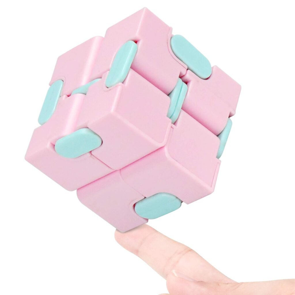 Infinity cube folding fidget toy in an adult hand, showing linked panels mid-fold.