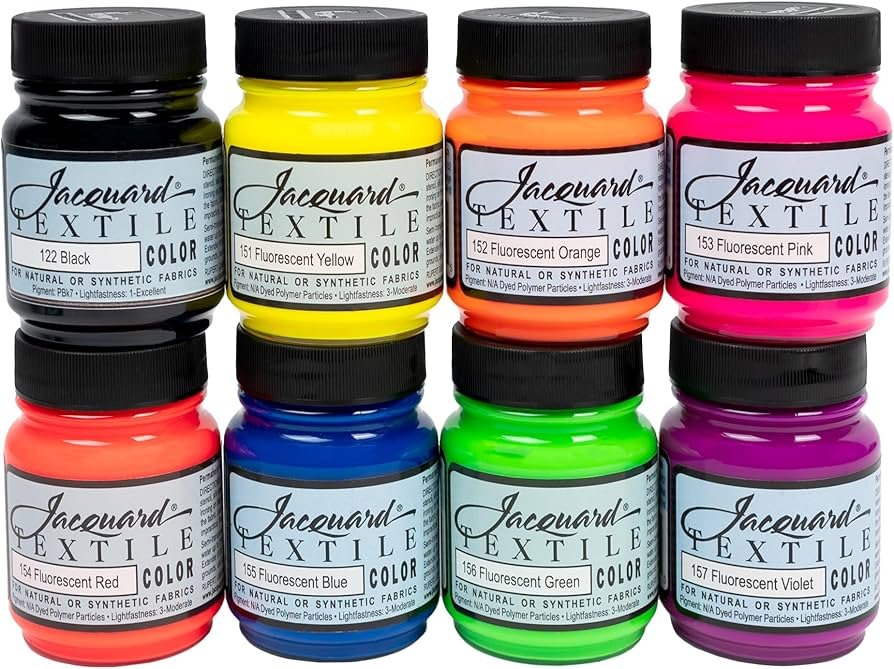 Jacquard textile paint bottles next to a hand-painted canvas tote bag with crisp, washable color