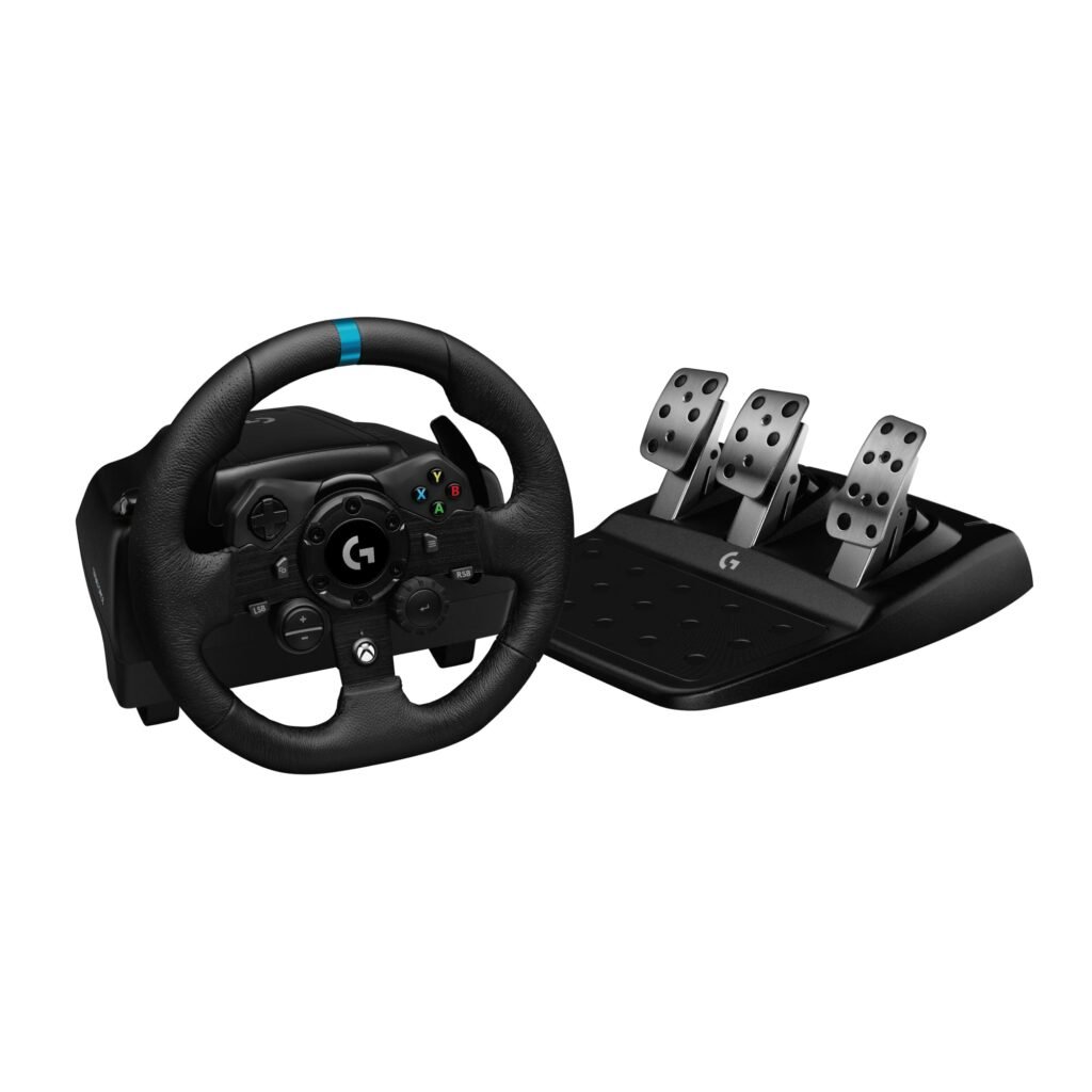 Logitech G923 steering wheel mounted on a desk with a 3-pedal set for PC racing games.