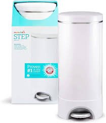 Modern nursery setup with a Munchkin Step Diaper Pail beside a changing table, showing a sealed, step-open lid for odor control.