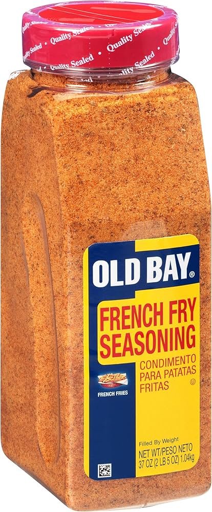 OLD BAY seasoning tin next to a basket of fries, showing a bold seasoning for fries in 2026.