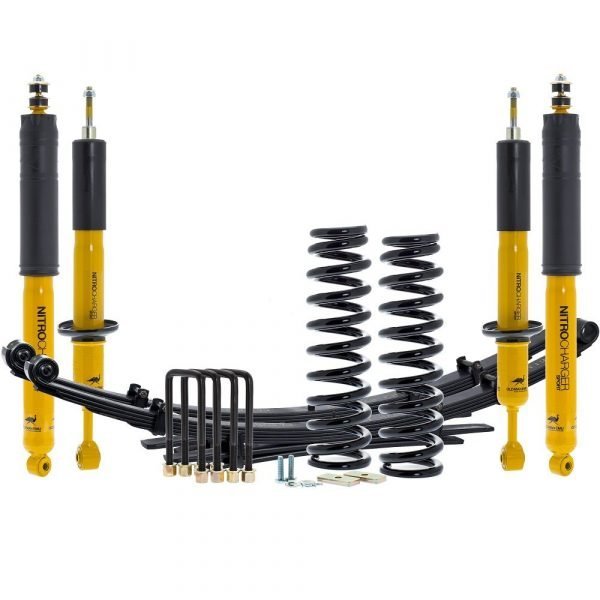 OME Tacoma suspension lift kit with matched springs and shocks on a Toyota Tacoma, shown as a comfort-focused 2026 setup.