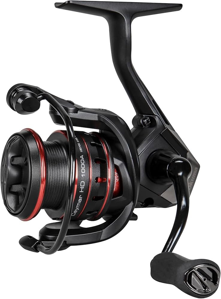 Okuma Ceymar HD spinning reel for bass, showing the spool, rotor, and handle grip.