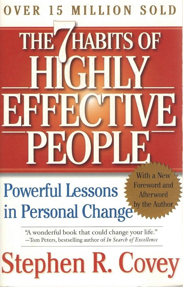 “The 7 Habits of Highly Effective People” book cover on a desk, representing the best self-help books for men for work and life structure.
