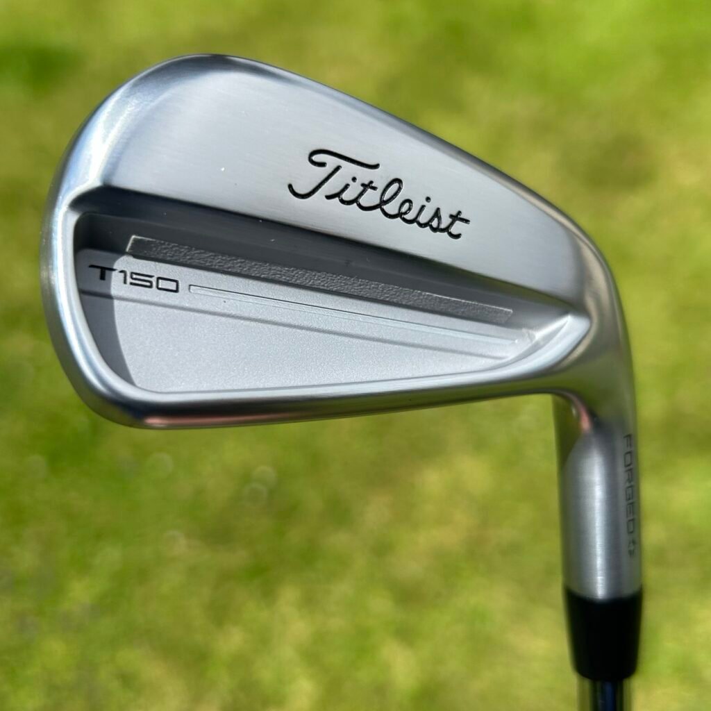 Titleist T150 irons at address with a thin topline, built for control-focused 10 handicap golfers.