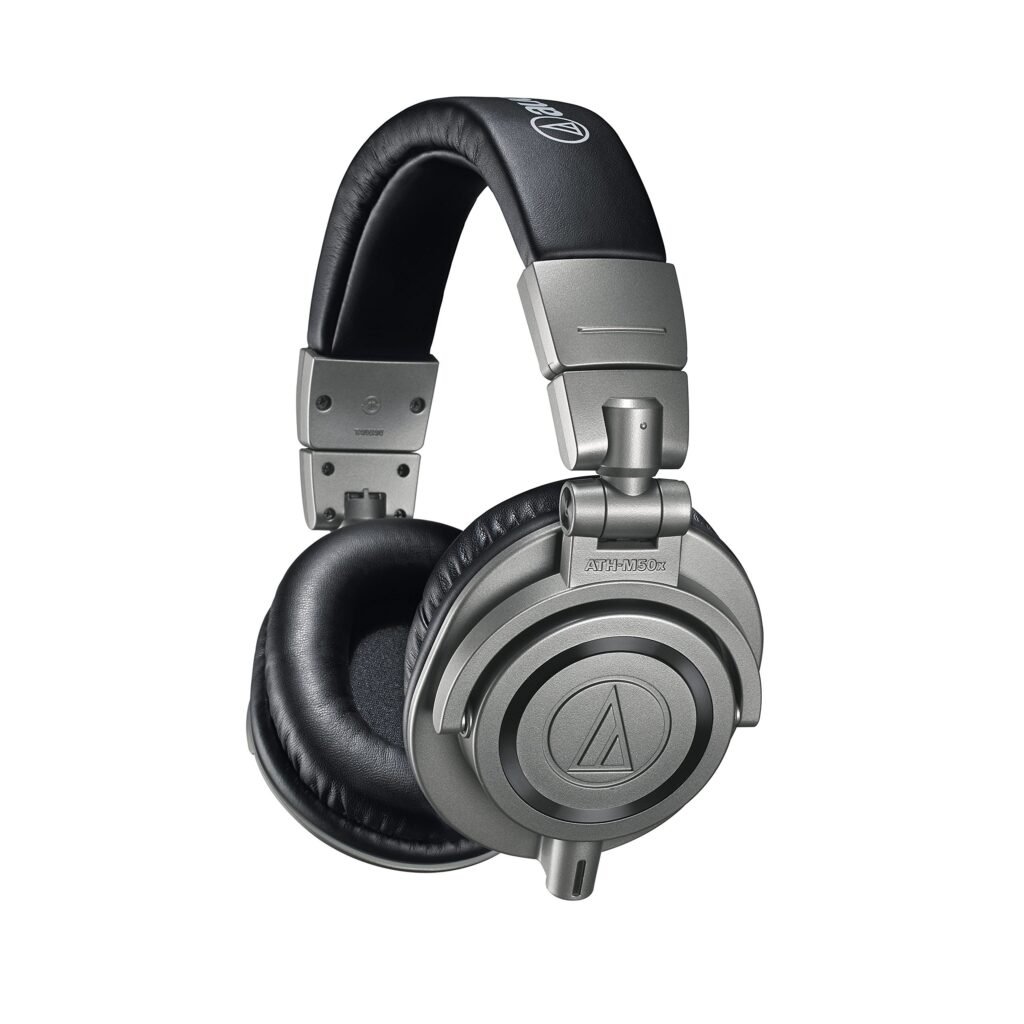 Audio-Technica ATH-M50x closed-back headphones connected to an electronic drum module, used for clear kick, snare, and cymbal detail.