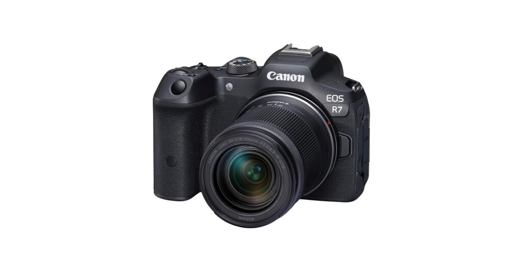 Canon EOS R7 APS-C camera with telephoto-style lens, shown for action digital photography in 2026.