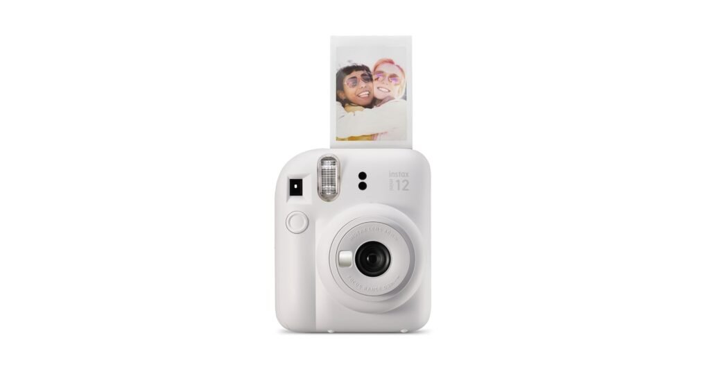 Fujifilm Instax Mini 12 instant camera in hand, used for fun digital photography-style prints in 2026.