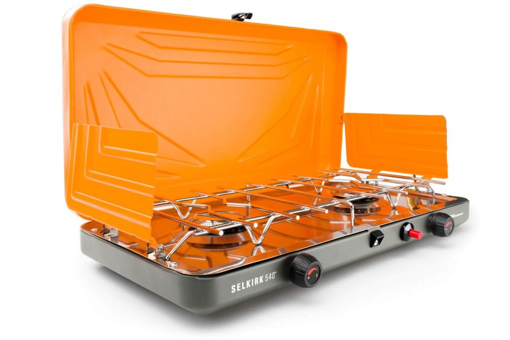GSI Outdoors Selkirk 540+ two-burner camp stove with wind protection, pictured for windy car camping spots.
