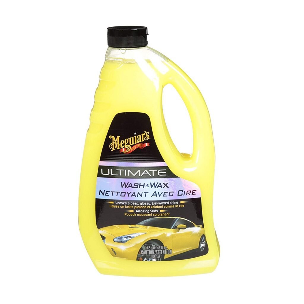 Meguiar’s Ultimate Wash & Wax bottle beside a wet hood with water beading after washing.