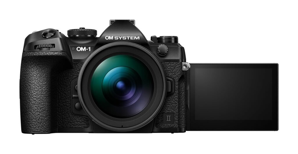 OM System OM-1 mirrorless camera in a compact outdoor setup, built for travel digital photography in 2026.