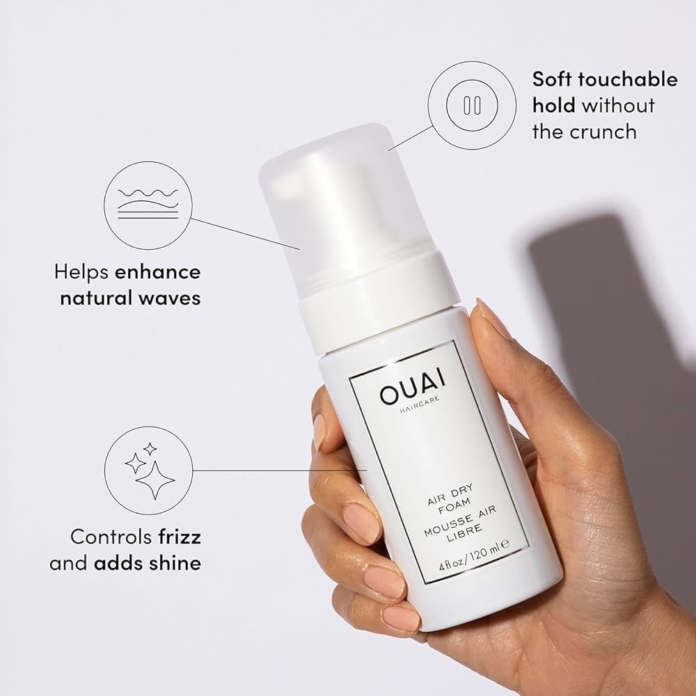 OUAI Air Dry Foam in a pump bottle used on damp wavy hair to keep air-dried waves defined and less frizzy.