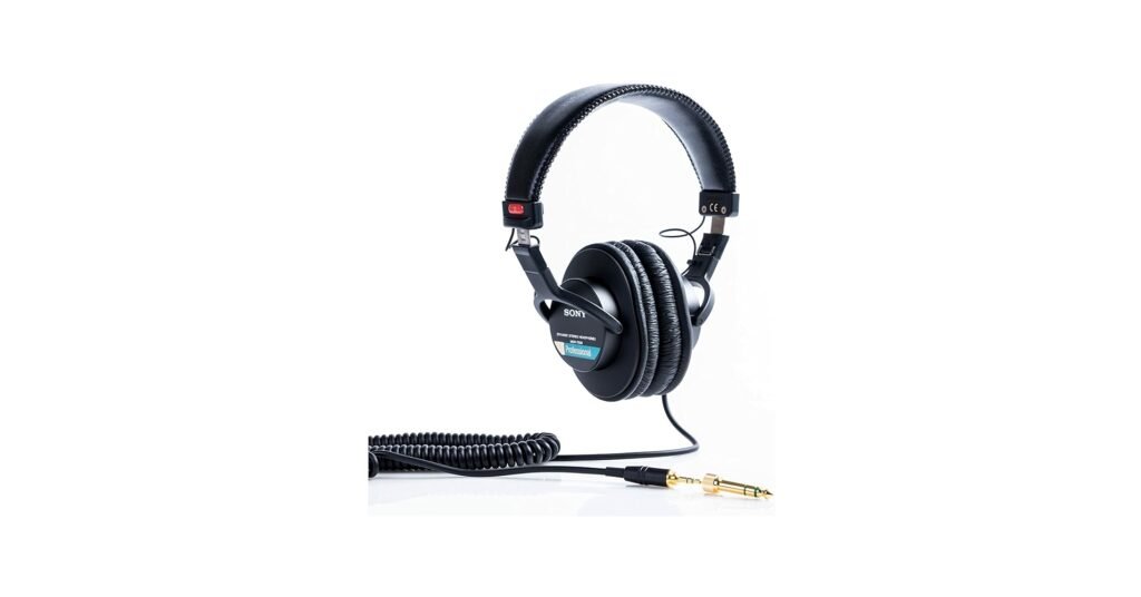 Sony MDR-7506 studio headphones used by a drummer during recording, chosen for clear monitoring of click, overheads, and guide tracks.