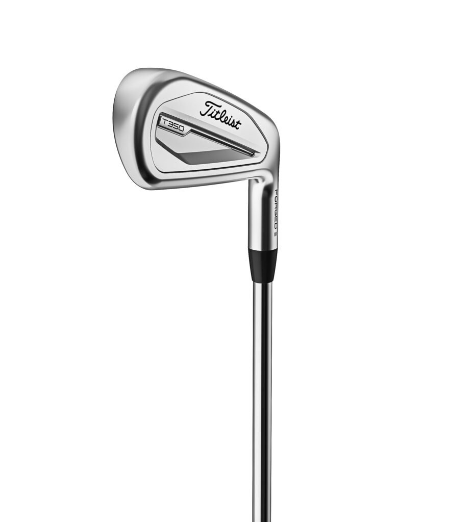 Titleist T350 irons are shown at address with a compact look, built for average golfers who want help without a bulky shape.